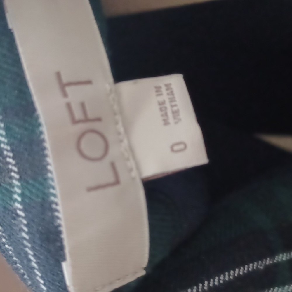 Loft mini skirt in size 0. It is green flannel with black and white lines.